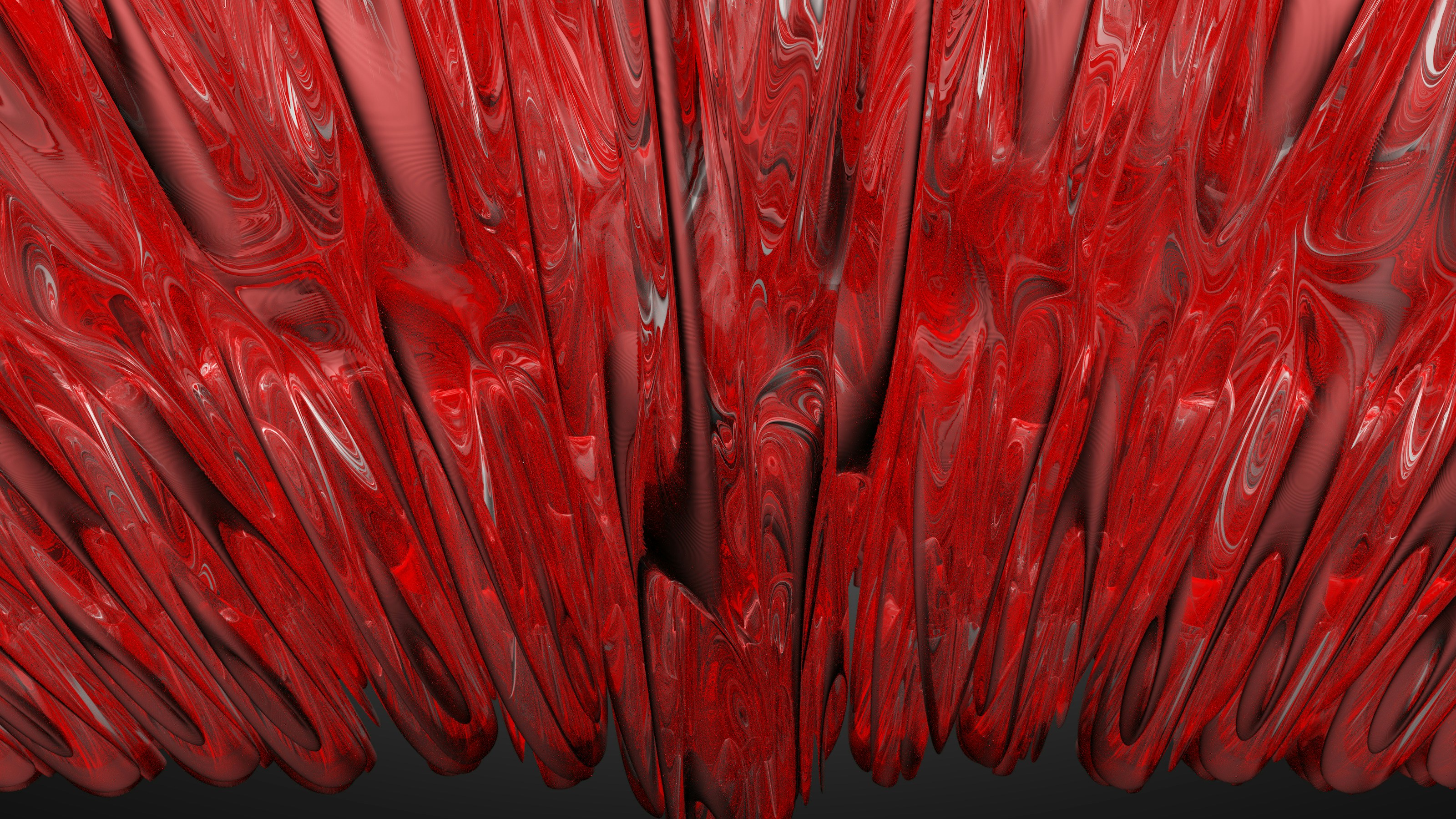 a close up of a red object with a black background